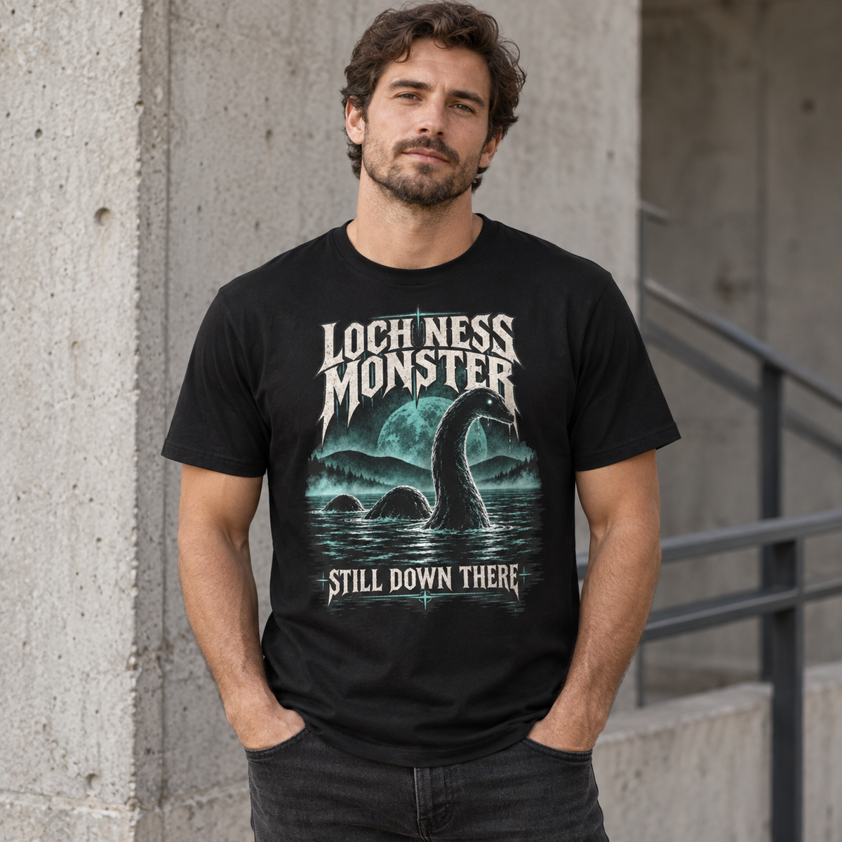 Loch Ness Monster Still Down There black cryptid graphic T-shirt worn by model – Astral Drift
