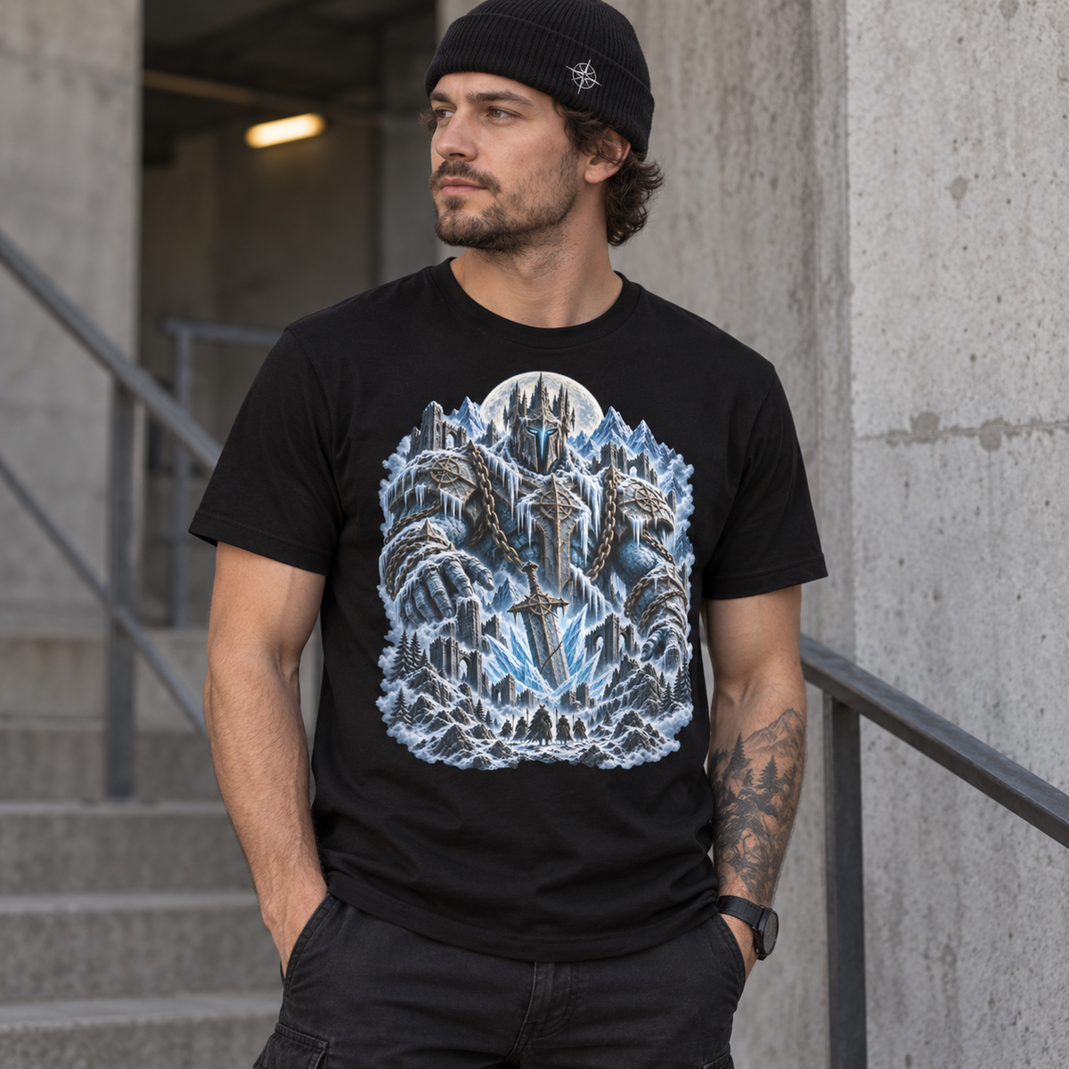 Model wearing black Frost Titan graphic T-shirt with colossal ice titan and moonlit frozen citadel artwork
