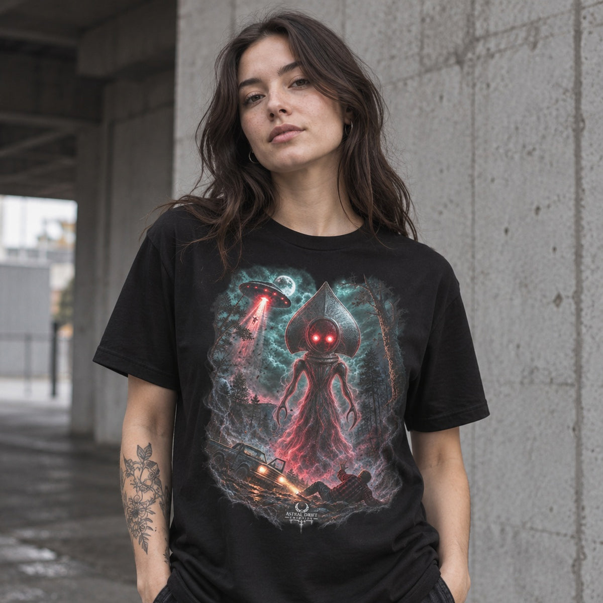 Female model wearing Flatwoods Monster black cryptid graphic T-shirt by Astral Drift