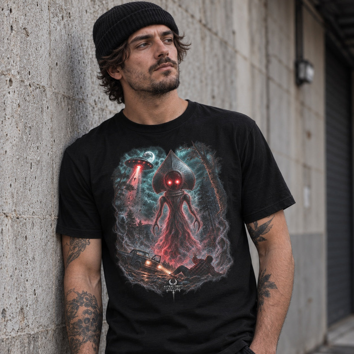 Male model wearing Flatwoods Monster black cryptid graphic T-shirt by Astral Drift